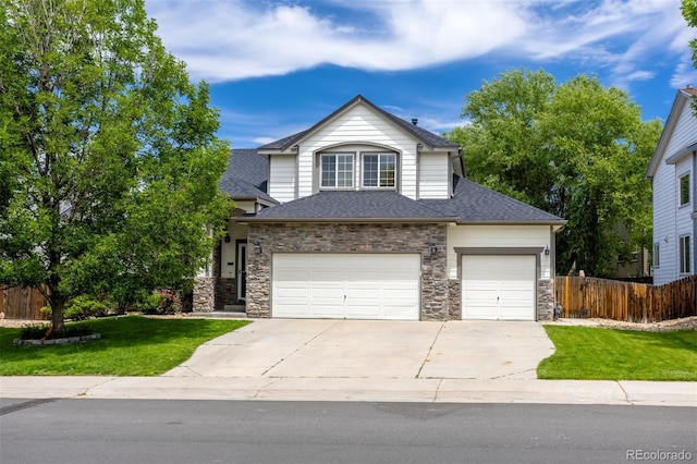 3775 Balderas St, Brighton, CO 80601 - view of front of home with concrete driveway, a shingled roof, and stone siding