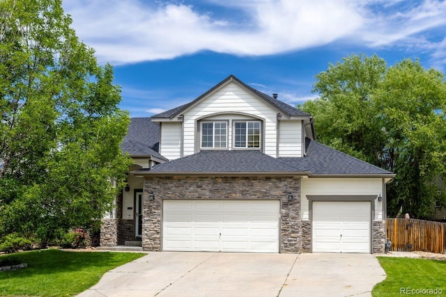 3775 Balderas St, Brighton, CO 80601 - view of front of home featuring roof with shingles, stone siding, concrete driveway, and an attached garage