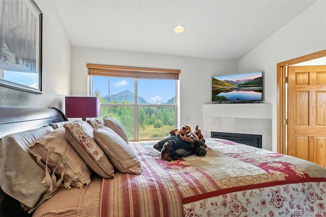 60 Black Diamond Trl Unit 60D, Silverthorne, CO 80498 - bedroom featuring a tiled fireplace, lofted ceiling, and recessed lighting