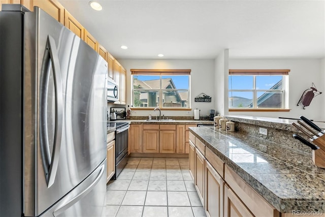 60 Black Diamond Trl Unit 60D, Silverthorne, CO 80498 - kitchen with appliances with stainless steel finishes, tile counters, healthy amount of natural light, recessed lighting, and light tile patterned floors