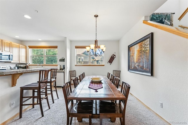 60 Black Diamond Trl Unit 60D, Silverthorne, CO 80498 - dining area with a chandelier, recessed lighting, a textured wall, and light carpet