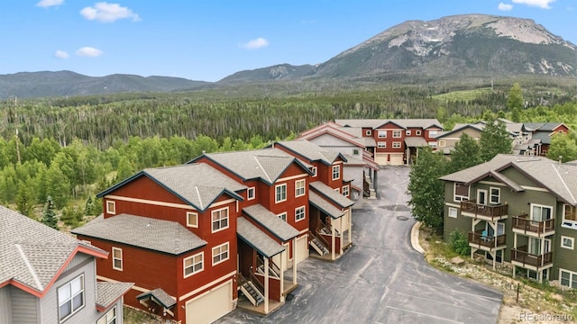 60 Black Diamond Trl Unit 60D, Silverthorne, CO 80498 - view of mountain backdrop featuring a heavily wooded area and nearby suburban area