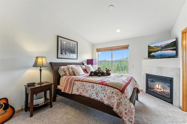 60 Black Diamond Trl Unit 60D, Silverthorne, CO 80498 - bedroom with light colored carpet, lofted ceiling, a tile fireplace, and access to outside