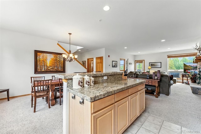 60 Black Diamond Trl Unit 60D, Silverthorne, CO 80498 - kitchen with light colored carpet, recessed lighting, a chandelier, light brown cabinetry, and a center island