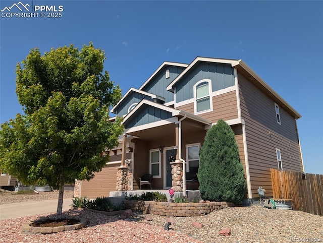 9233 Waters Edge Dr, Fountain, CO 80817 - craftsman-style house with covered porch and board and batten siding