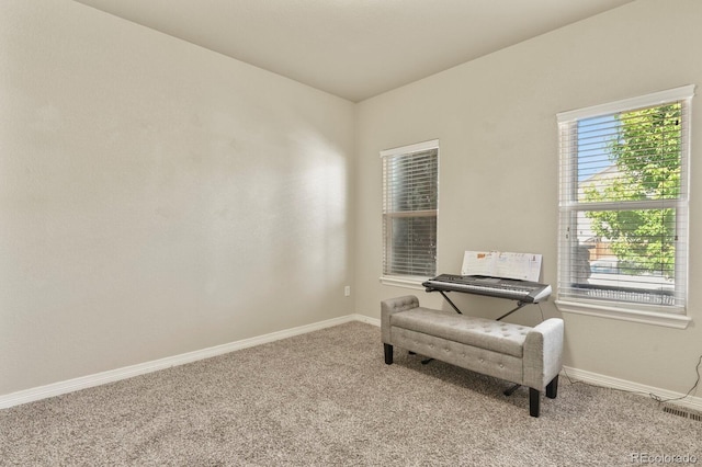9233 Waters Edge Dr, Fountain, CO 80817 - living area featuring carpet floors and baseboards