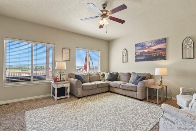 9233 Waters Edge Dr, Fountain, CO 80817 - living room with ceiling fan, carpet flooring, and a textured ceiling