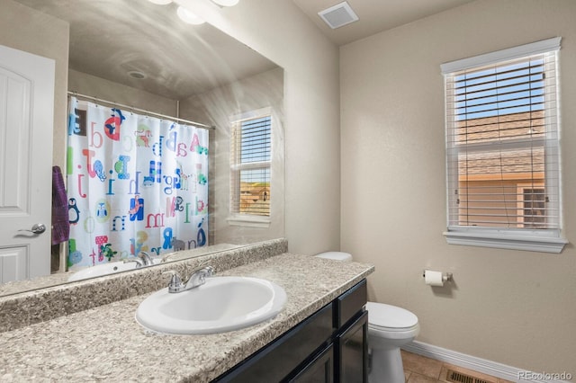 9233 Waters Edge Dr, Fountain, CO 80817 - full bathroom with vanity, tile patterned flooring, and curtained shower