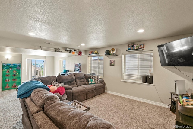 9233 Waters Edge Dr, Fountain, CO 80817 - living room featuring carpet floors, a textured ceiling, and recessed lighting