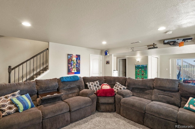 9233 Waters Edge Dr, Fountain, CO 80817 - living area featuring recessed lighting, a textured ceiling, light carpet, and stairway