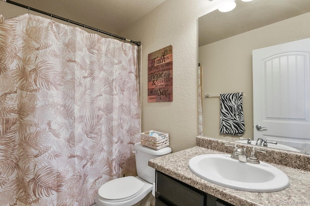 9233 Waters Edge Dr, Fountain, CO 80817 - bathroom with a textured wall, vanity, and a shower with shower curtain