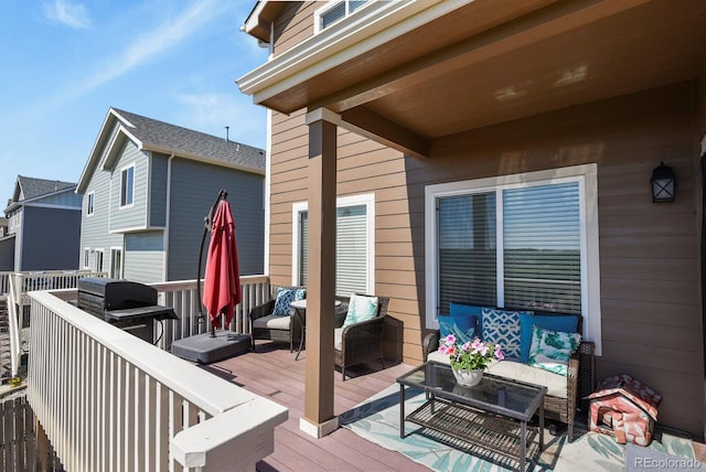 9233 Waters Edge Dr, Fountain, CO 80817 - wooden terrace featuring an outdoor living space and a grill