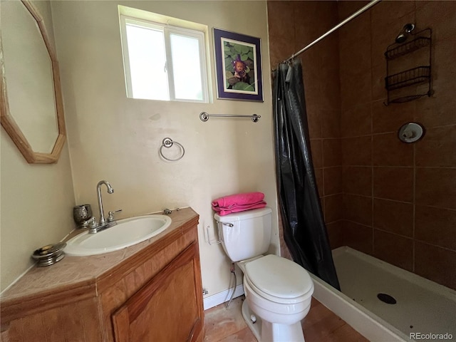 bathroom with walk in shower, toilet, and large vanity