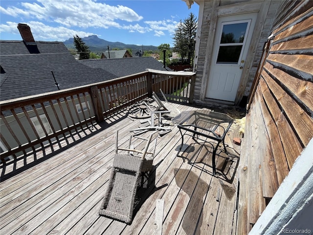 wooden terrace featuring a mountain view