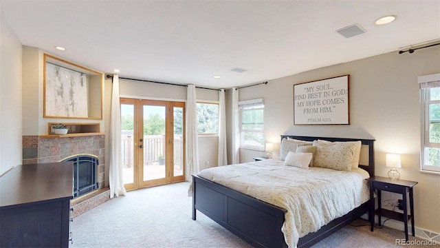 6278 E Euclid Ave, Centennial, CO 80111 - bedroom with access to outside, light carpet, a fireplace, recessed lighting, and french doors