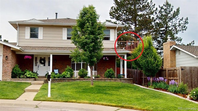 6278 E Euclid Ave, Centennial, CO 80111 - view of front of home with stone siding and a porch