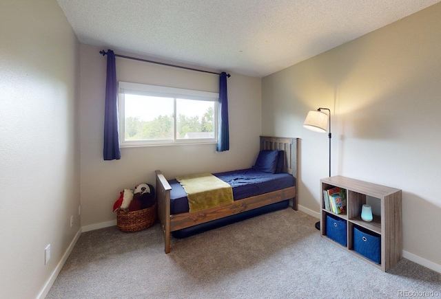 6278 E Euclid Ave, Centennial, CO 80111 - carpeted bedroom with a textured ceiling and baseboards