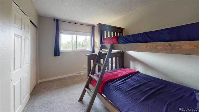 6278 E Euclid Ave, Centennial, CO 80111 - bedroom with carpet flooring, a textured ceiling, and baseboards
