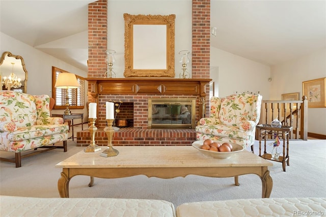 living room featuring lofted ceiling, a fireplace, and carpet