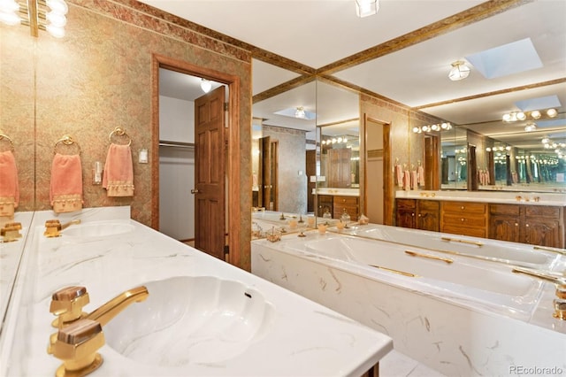 bathroom featuring vanity and a washtub