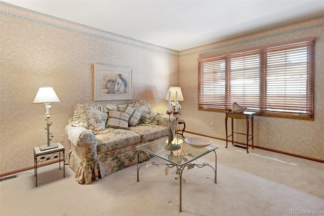 carpeted living room with a healthy amount of sunlight