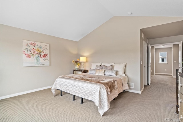 carpeted bedroom with visible vents, vaulted ceiling, and baseboards