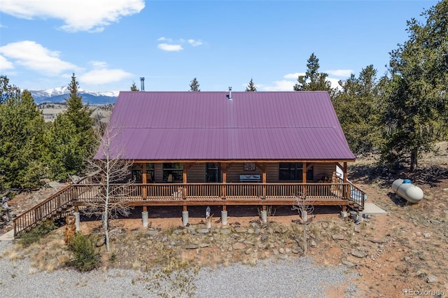 1838 E Longbow Dr, Como, CO 80432 - back of house featuring metal roof, a mountain view, and covered porch