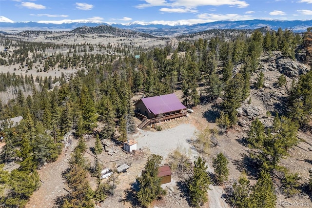 1838 E Longbow Dr, Como, CO 80432 - view of subject property with a mountain backdrop and a heavily wooded area