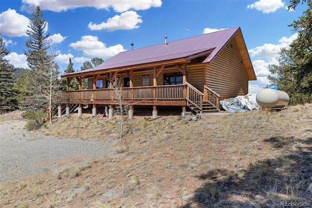 1838 E Longbow Dr, Como, CO 80432 - back of house with metal roof, log veneer siding, and a porch