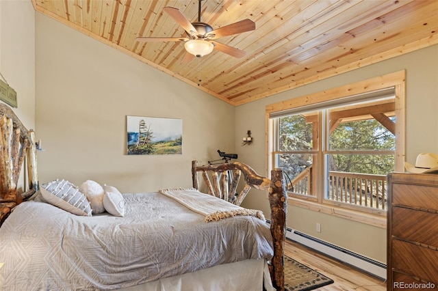 1838 E Longbow Dr, Como, CO 80432 - bedroom featuring wood ceiling, a baseboard radiator, wood finished floors, and lofted ceiling