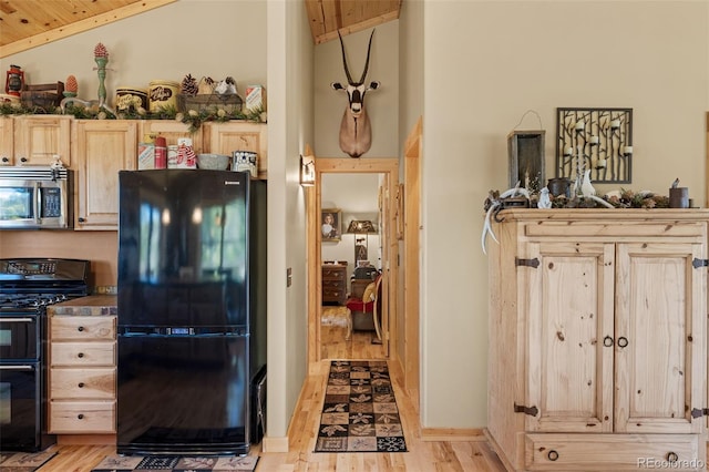 1838 E Longbow Dr, Como, CO 80432 - kitchen featuring black appliances, light brown cabinets, light wood-type flooring, wood ceiling, and high vaulted ceiling