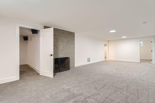 10698 W 26th Ave, Lakewood, CO 80215 - unfurnished living room with carpet flooring, a brick fireplace, baseboards, and recessed lighting