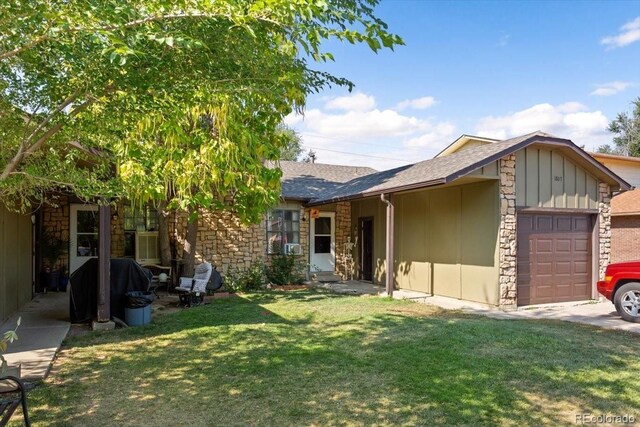 ranch-style house with a front lawn and a garage