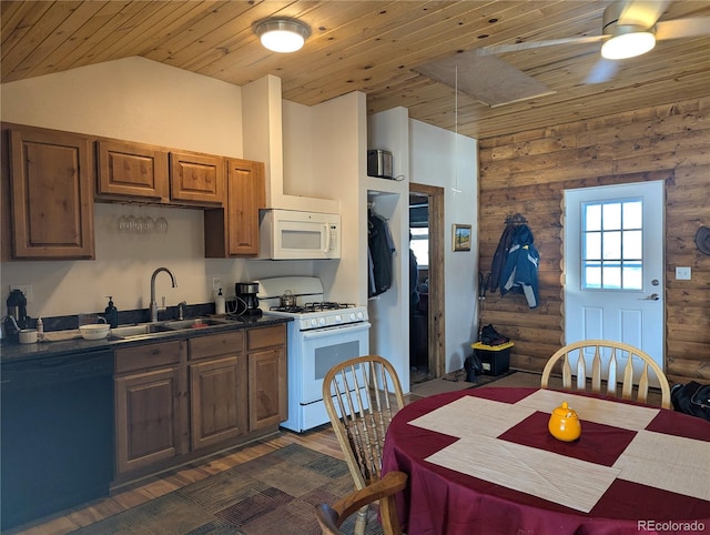 kitchen with lofted ceiling, sink, log walls, wood ceiling, and white appliances