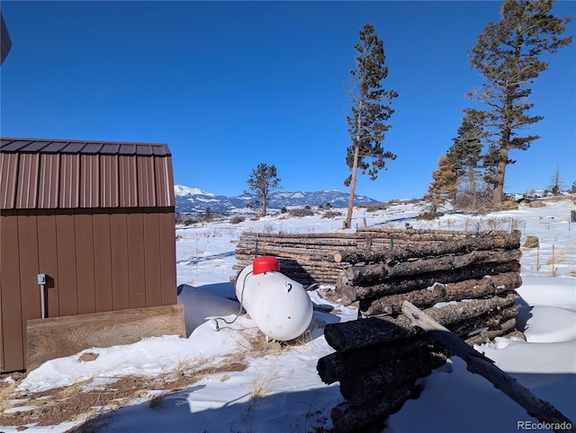 snowy yard with a mountain view