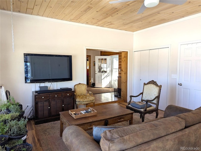 living area with a ceiling fan, wood finished floors, wood ceiling, and ornamental molding