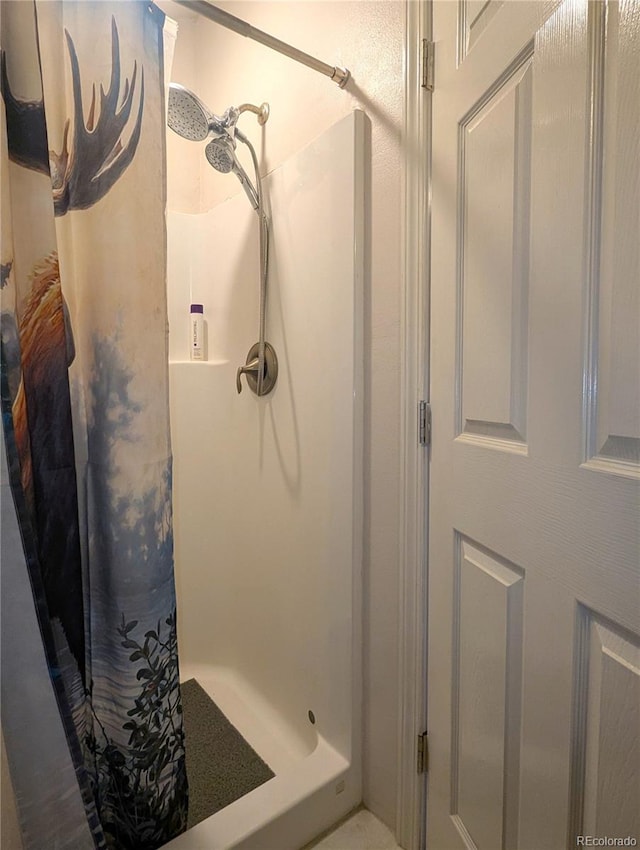 bathroom with a stall shower