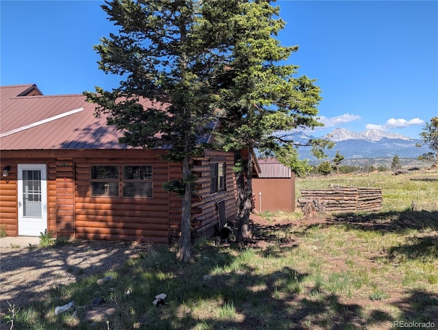 613 Macdonald Pl, Fort Garland, CO 81133 - view of side of home with a mountain view and metal roof