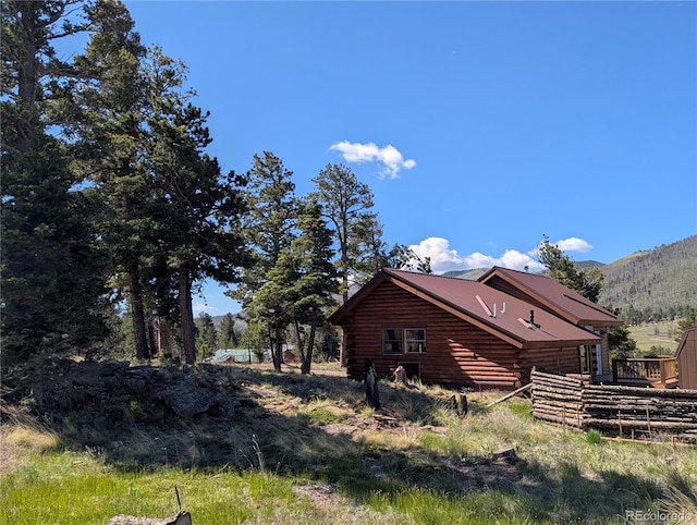 613 Macdonald Pl, Fort Garland, CO 81133 - view of side of property featuring log exterior and a mountain view