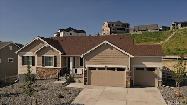 4121 River Oaks St, Castle Rock, CO 80104 - craftsman inspired home with a garage, stone siding, and driveway