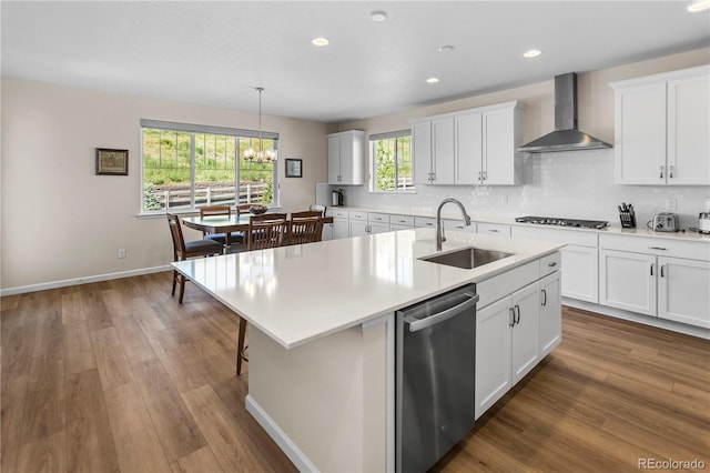4121 River Oaks St, Castle Rock, CO 80104 - kitchen featuring wall chimney exhaust hood, appliances with stainless steel finishes, a chandelier, light countertops, and backsplash