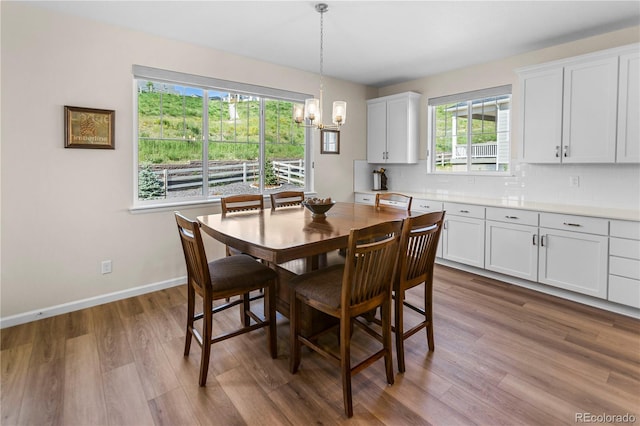 4121 River Oaks St, Castle Rock, CO 80104 - dining area with a chandelier and wood finished floors