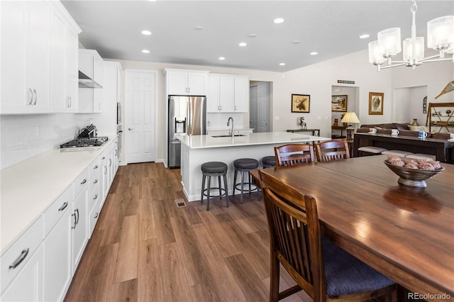 4121 River Oaks St, Castle Rock, CO 80104 - dining area featuring recessed lighting, dark wood-style flooring, a chandelier, and lofted ceiling