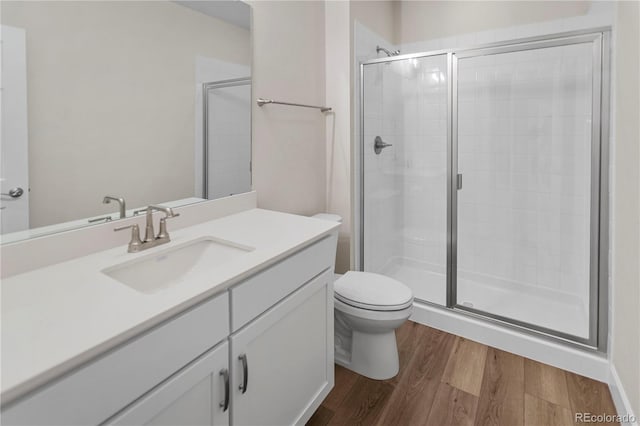 4121 River Oaks St, Castle Rock, CO 80104 - bathroom featuring vanity, a stall shower, and wood finished floors