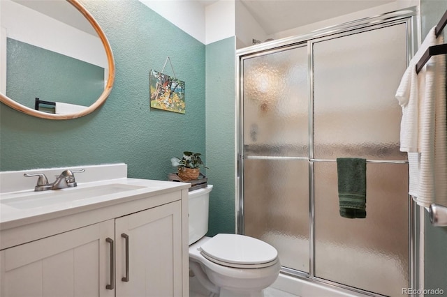 12753 Buckhorn Creek St, Parker, CO 80134 - bathroom featuring a textured wall, toilet, a shower stall, and vanity