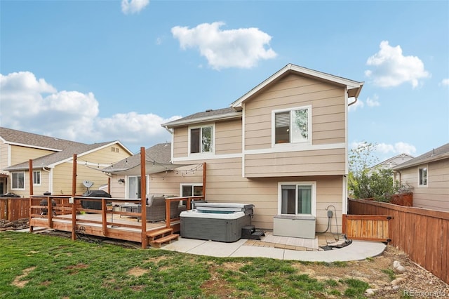 12753 Buckhorn Creek St, Parker, CO 80134 - back of house featuring a hot tub and a deck