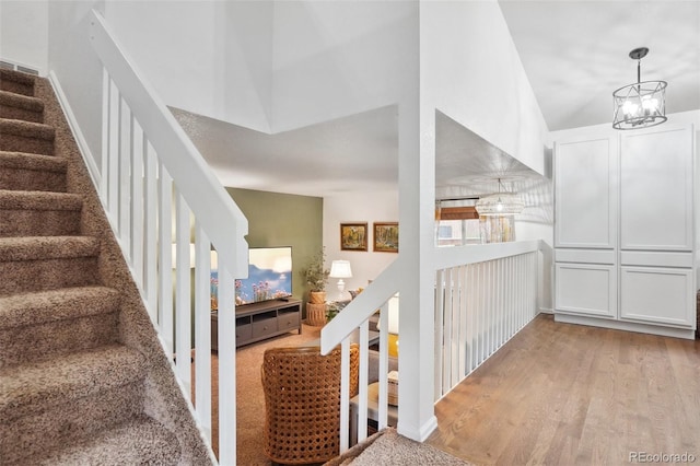 12753 Buckhorn Creek St, Parker, CO 80134 - stairs with wood finished floors and a chandelier