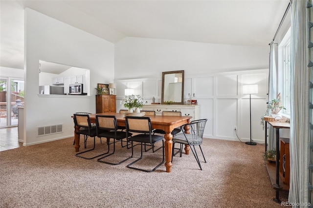 12753 Buckhorn Creek St, Parker, CO 80134 - dining space with light carpet and high vaulted ceiling