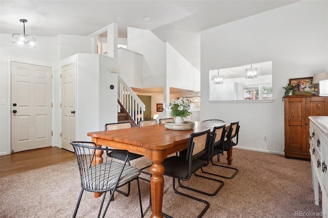 12753 Buckhorn Creek St, Parker, CO 80134 - dining room featuring stairs, carpet, baseboards, and high vaulted ceiling