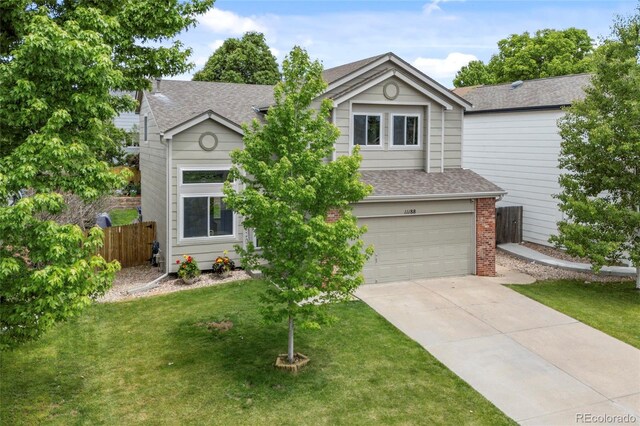 11188 Latigo Ln, Parker, CO 80138 - view of front facade featuring a garage, a shingled roof, concrete driveway, and brick siding